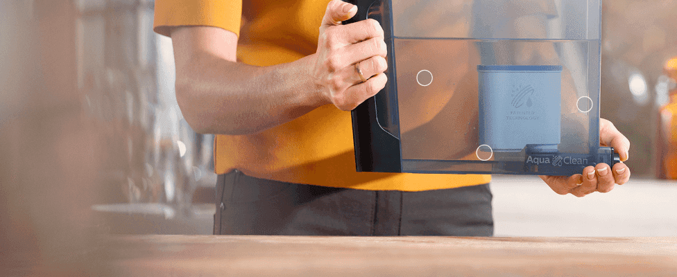 Shows shoppers how easily the AquaClean filter can be installed or removed from the machine's water tank. Reinforces that the filter is simple and hassle-free to fit into the machine.
