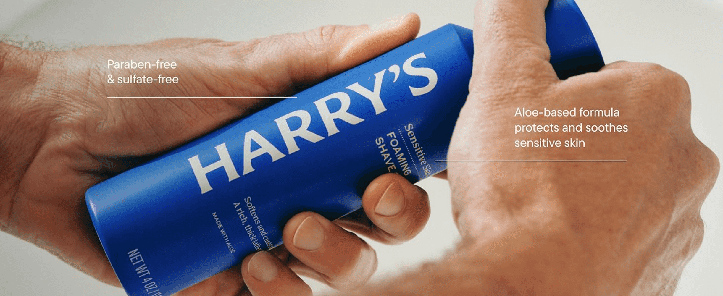 Shows the can in use with two callouts, reassuring shoppers the formula is gentle and free of parabens and sulfates.