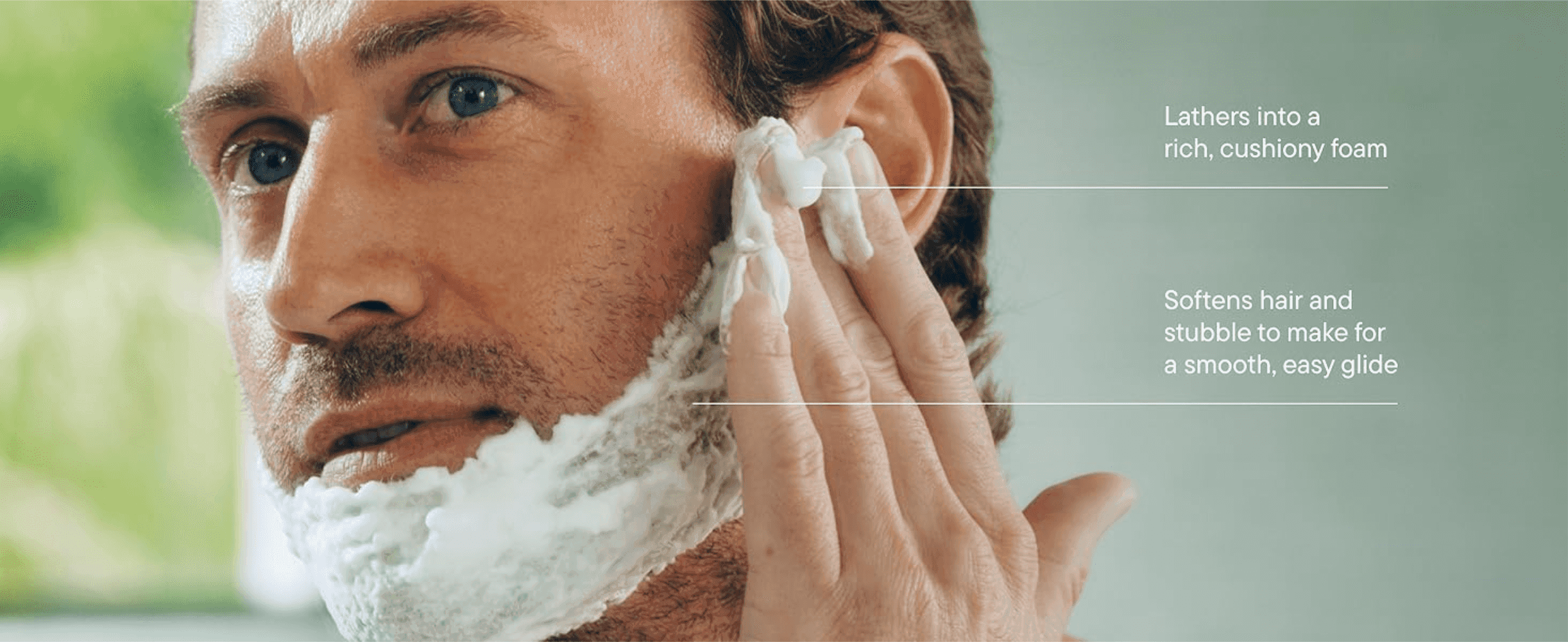 Shows the foam being applied to reassure shoppers it lathers richly and softens stubble for a smooth shave.