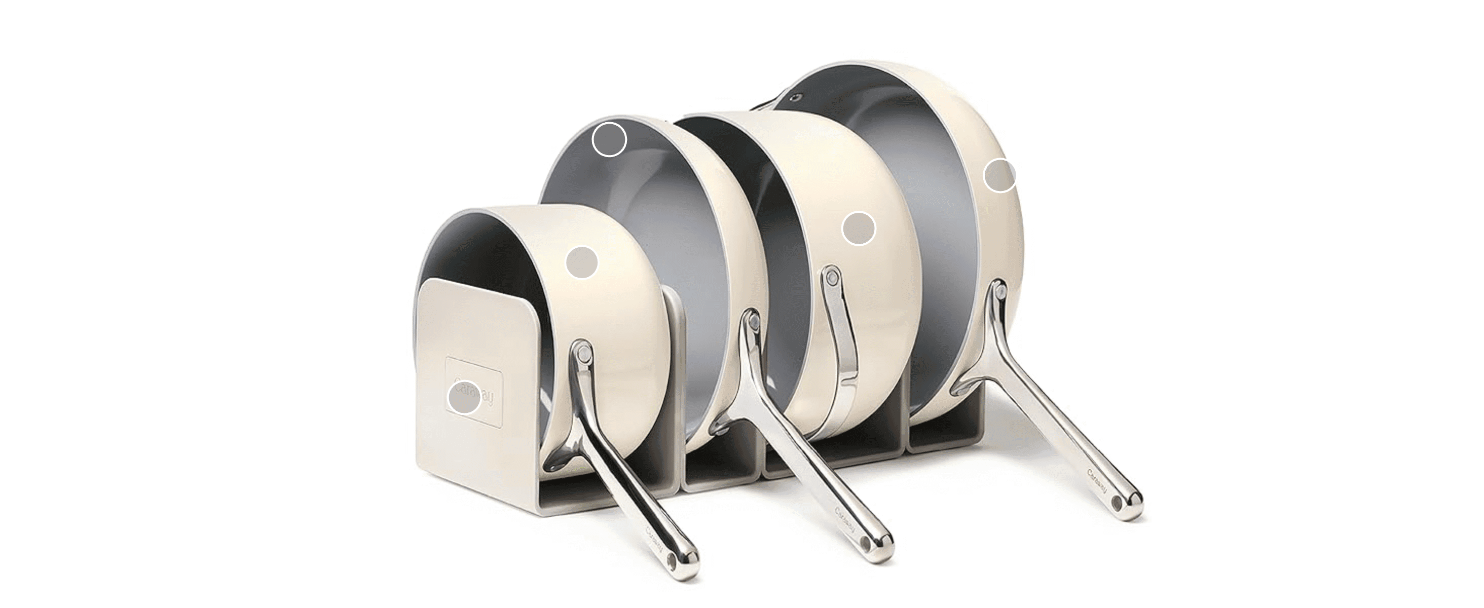 Shows every pan in the set together with its storage rack, so shoppers see what they receive. Uses hotspot dots on each piece so shoppers can explore the parts of the set.
