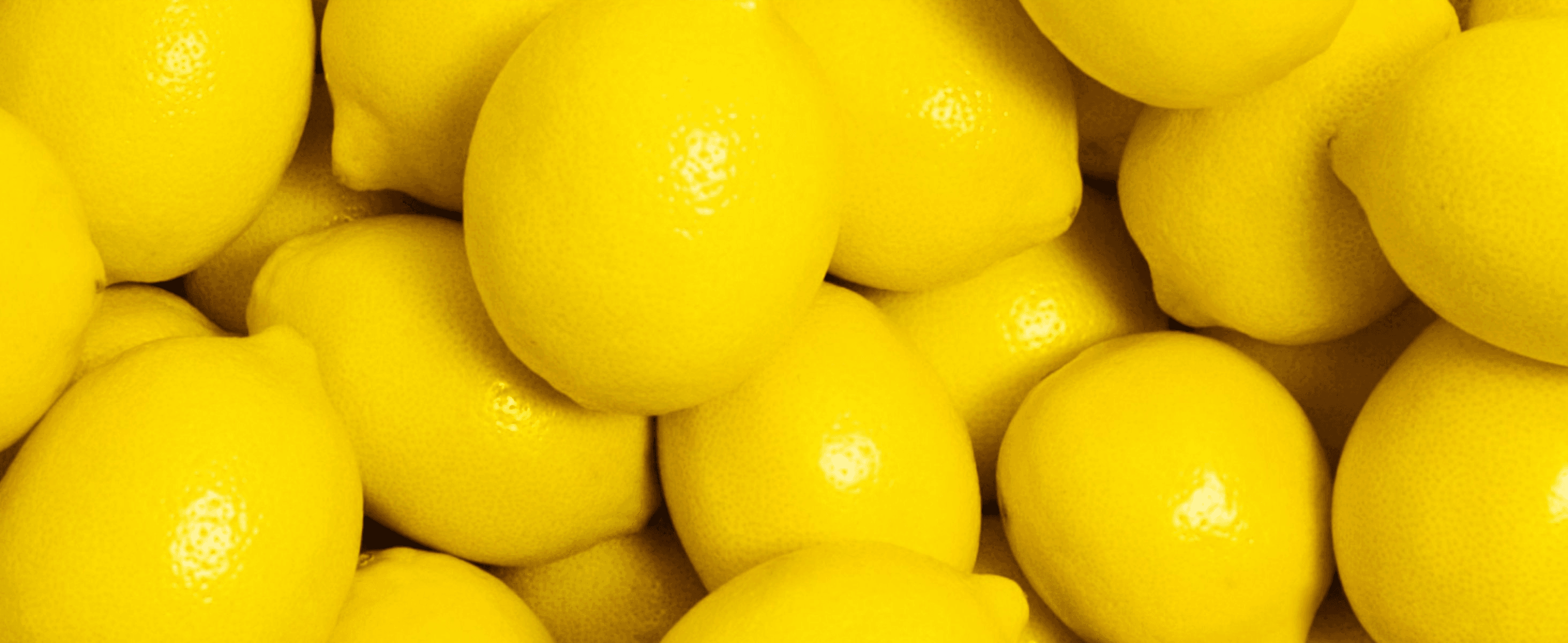 Uses a close-up of fresh lemons to signal natural, real-fruit ingredients.