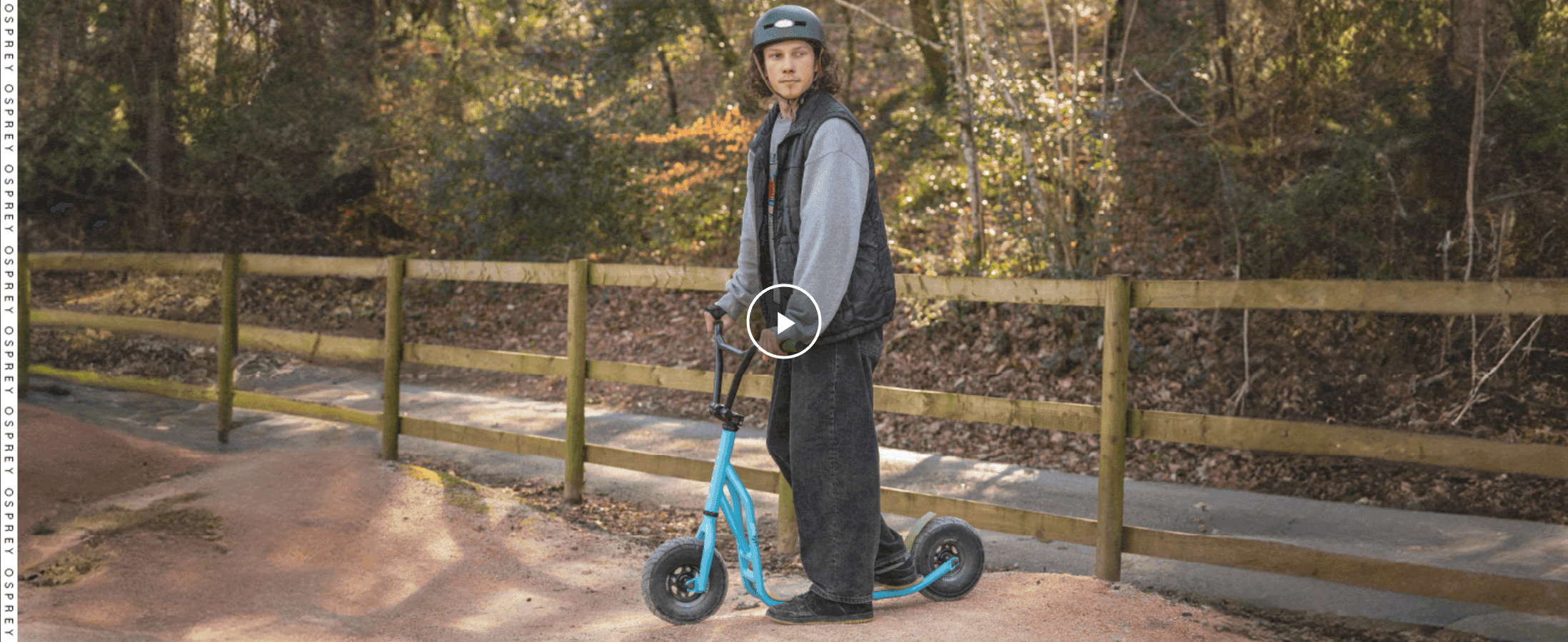 Shows the scooter being ridden outdoors to help shoppers picture real-world use.