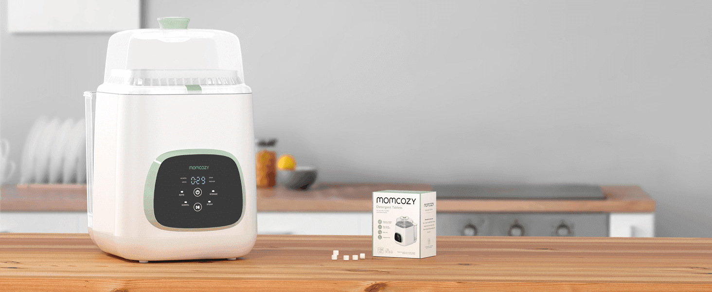 Shows the washer and detergent tablets in a real kitchen setting to help shoppers picture it in their own home.