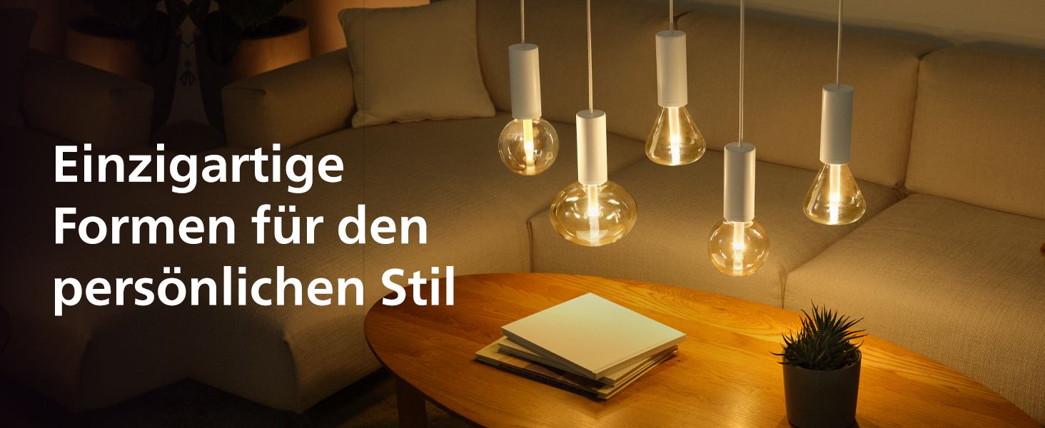 Shows the distinctive bulb shapes in a warm living room setting so shoppers see how the lamps add personal style to their home.