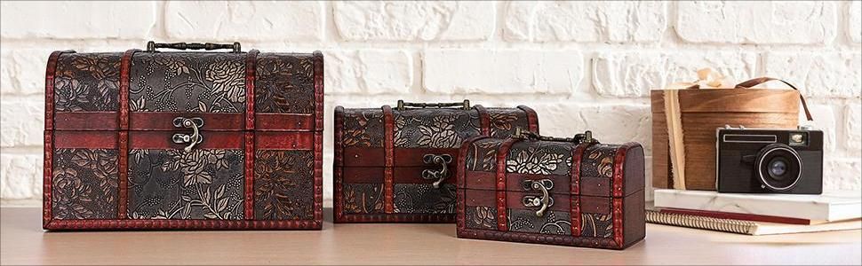Presents the three nested vintage trunks as a gift-ready set that suits holiday or occasion giving. The styled scene with a retro camera and books reinforces a decorative, giftable appeal. Shows the…