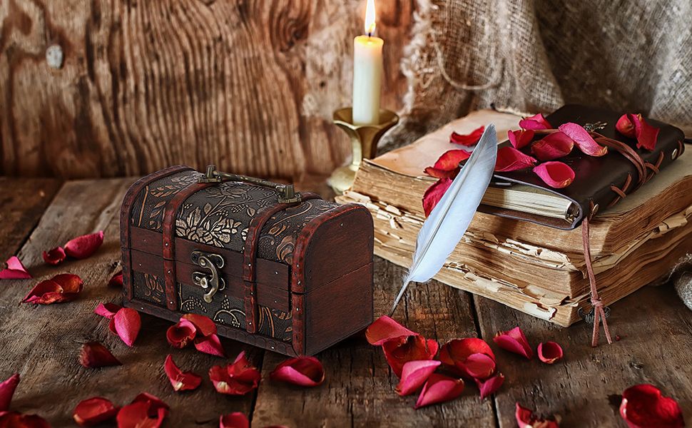 Shows the product styled in a warm rustic scene with candlelight, rose petals, and an antique journal to help shoppers envision it as a keepsake or decorative accent.