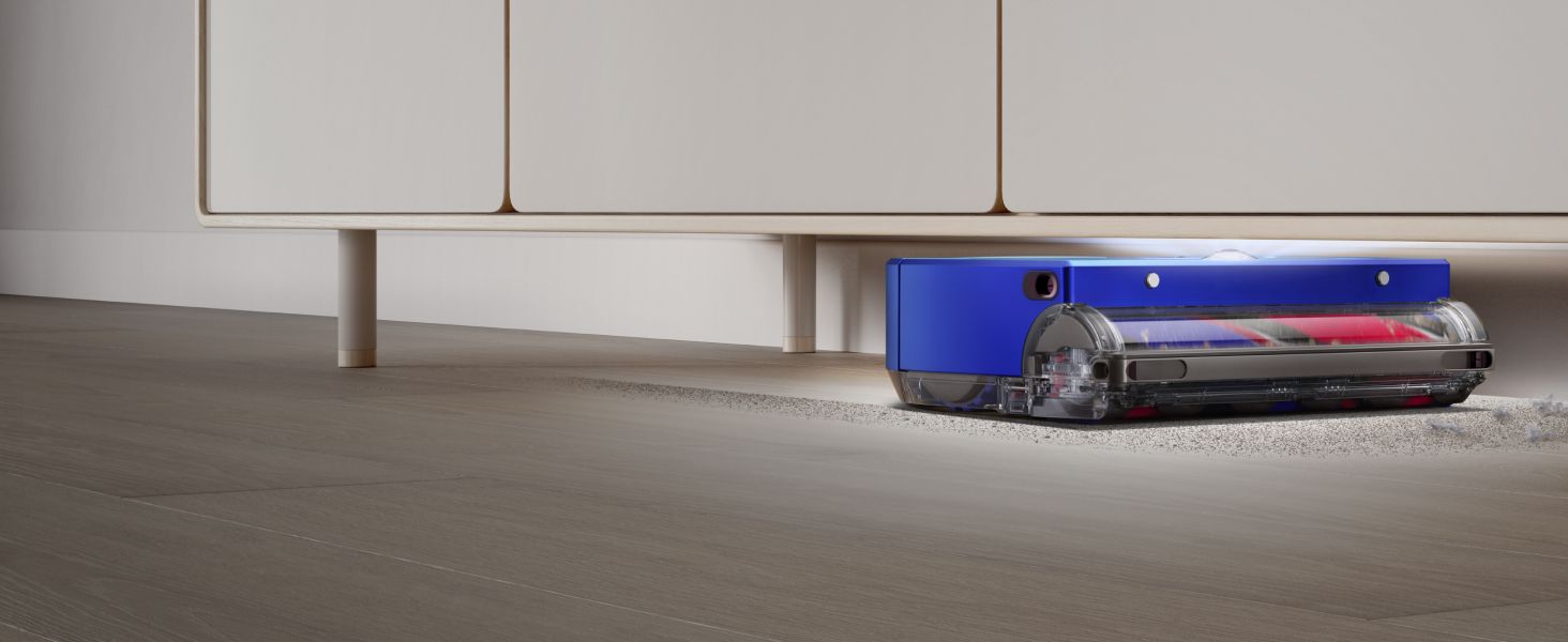 Highlights the vacuum's slim profile and ability to clean beneath furniture, helping shoppers understand it can reach difficult spaces in their home.