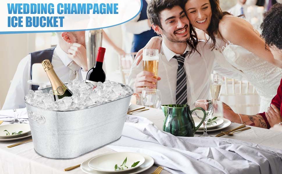 Shows the ice bucket set on a wedding reception table with champagne and wine, helping shoppers picture it at their own celebrations. Not applicable.