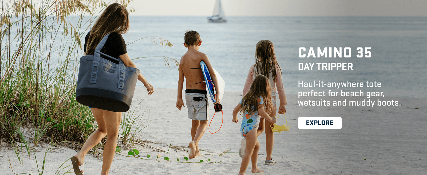 Shows the product in a real-world beach setting to help shoppers envision using the bag for outdoor and beach activities.