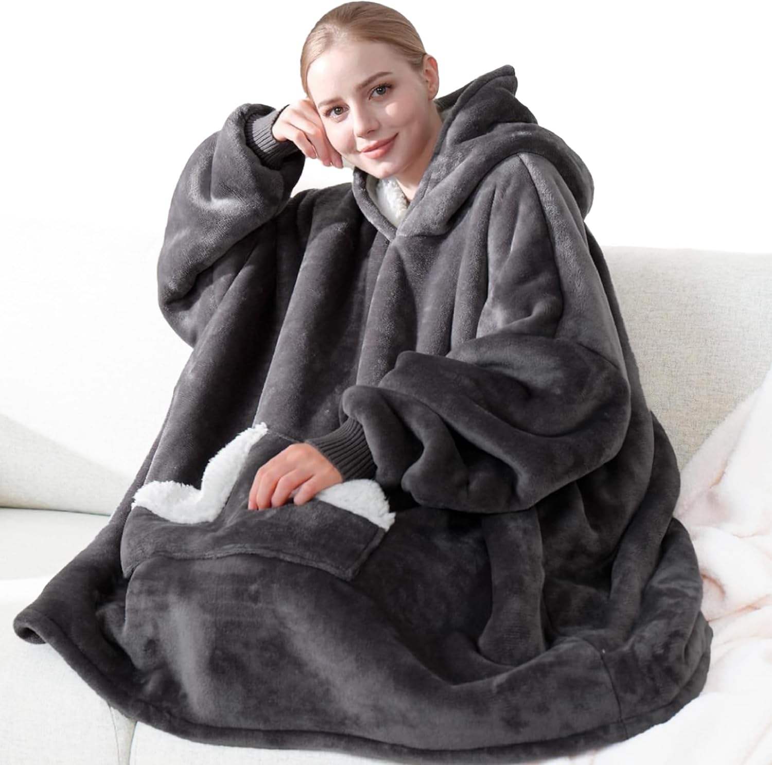 Showcases the comfort and warmth of the wearable blanket product Demonstrates the product's use in a comfortable, casual environment
