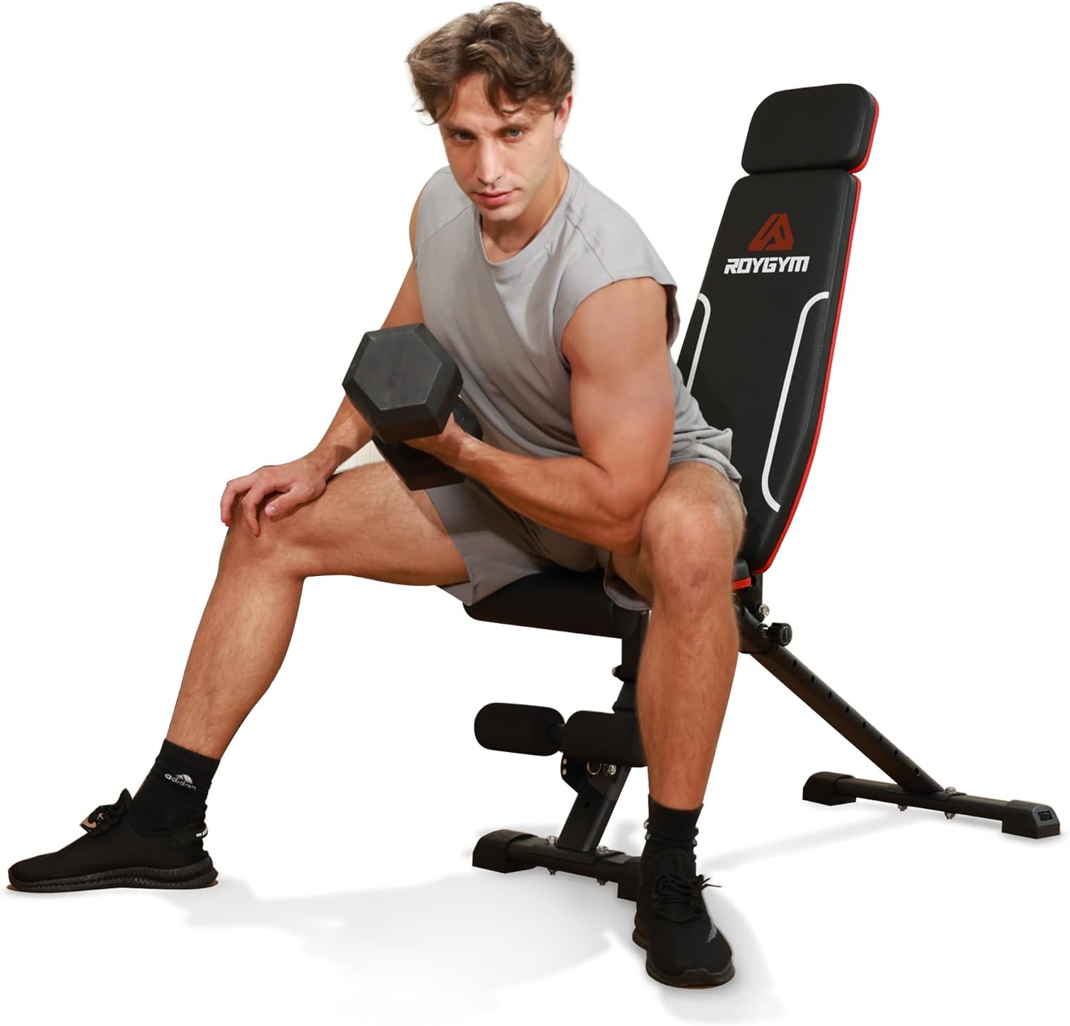 Shows a model using the weight bench and dumbbell to demonstrate proper form and the product's functionality for strength training.