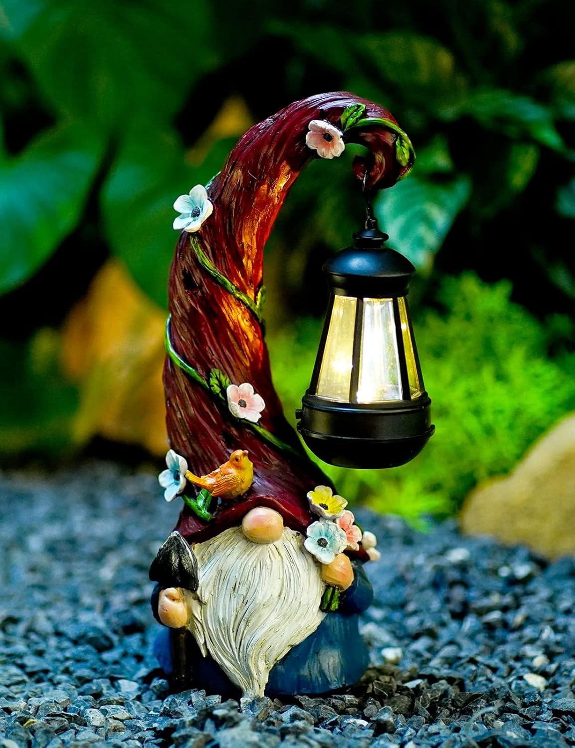Showcases a decorative garden gnome with a solar lantern, highlighting its whimsical design and functionality as an outdoor lighting accessory.