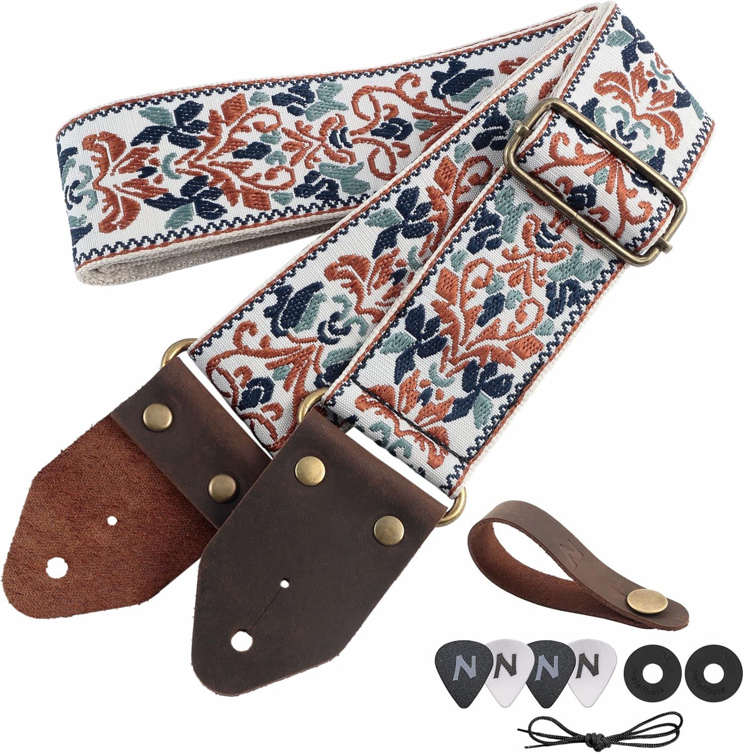 Shows the guitar strap along with all included accessories such as leather ends, picks, washers, and laces to communicate the complete value of the purchase.