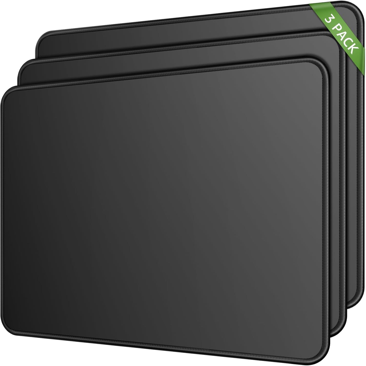 Shows the core product clearly - three identical dark gray/black rectangular items (likely laptop sleeves or baking sheets) stacked to display the 3-pack quantity included in the purchase. The green…