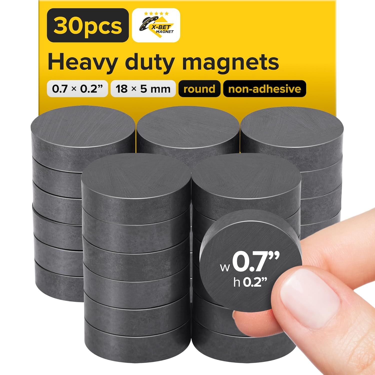Shows the complete set of 30 heavy-duty round magnets with clear specifications to communicate quantity, size, and type to the shopper. Uses a human hand holding one magnet to provide scale…