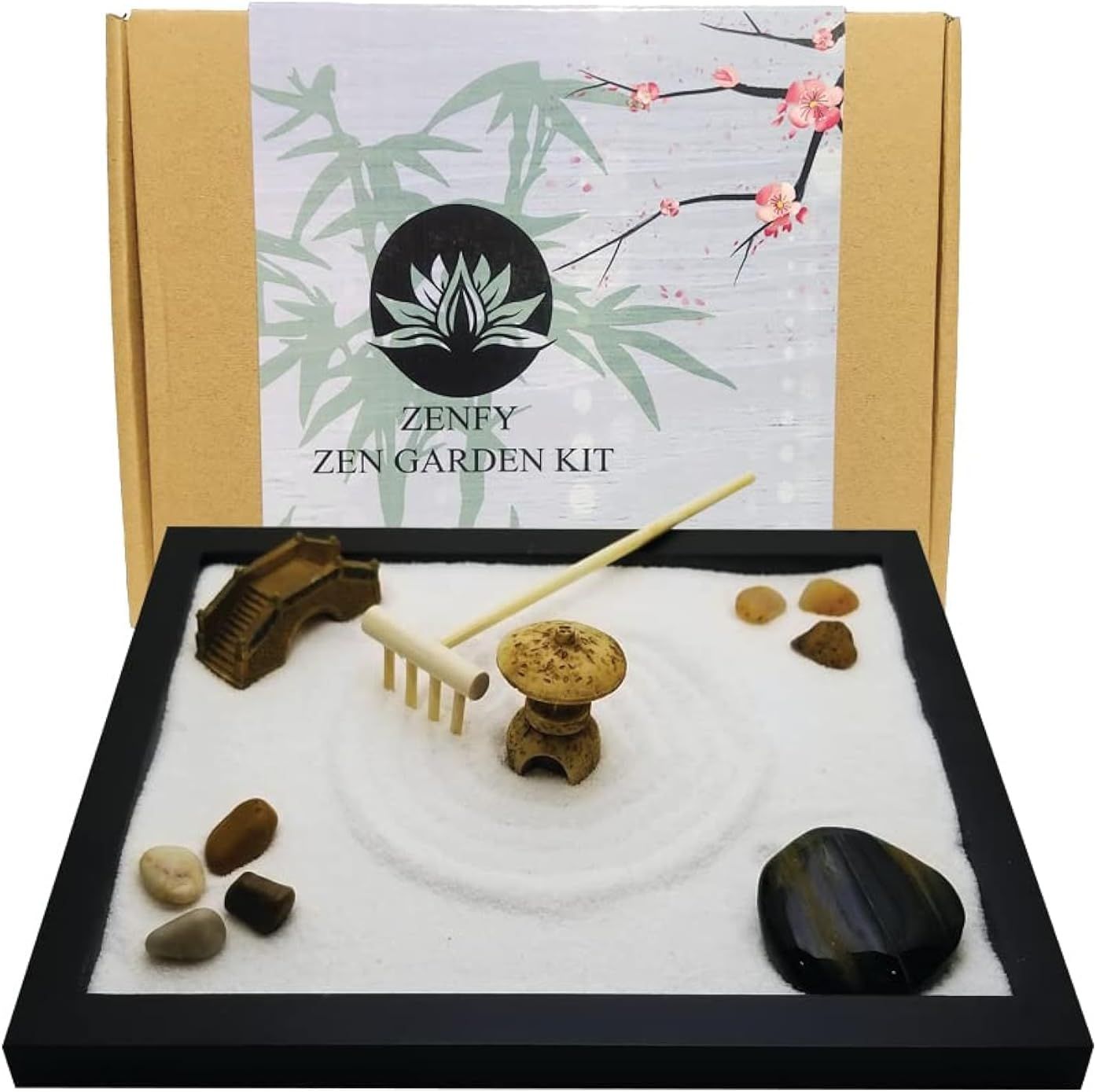 Shows the complete zen garden kit with all included components (tray, sand, rake, stones, pagoda, bridge) to communicate the full value and contents of the…