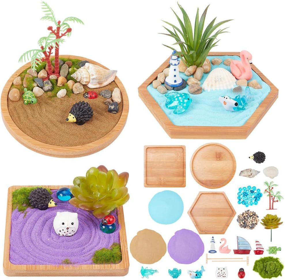 Shows the complete miniature zen garden kit with three assembled examples and all included components to demonstrate the variety and creative possibilities of the product. Displays all the included…