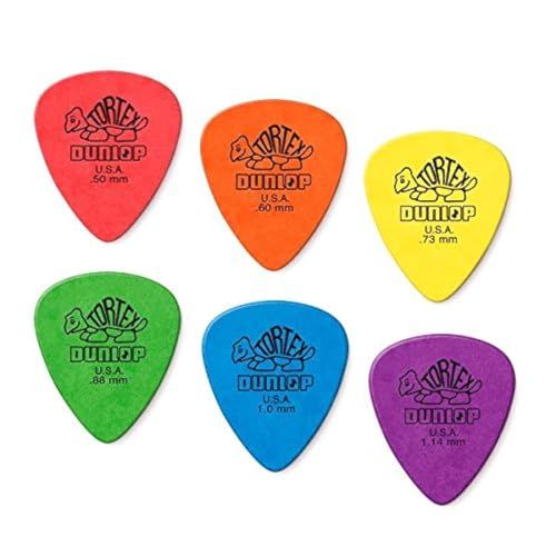 Displays the core product (guitar picks) in a clean catalog-style presentation, showing the Dunlop Tortex picks with their distinctive turtle logo and thickness markings. Shows the available color…