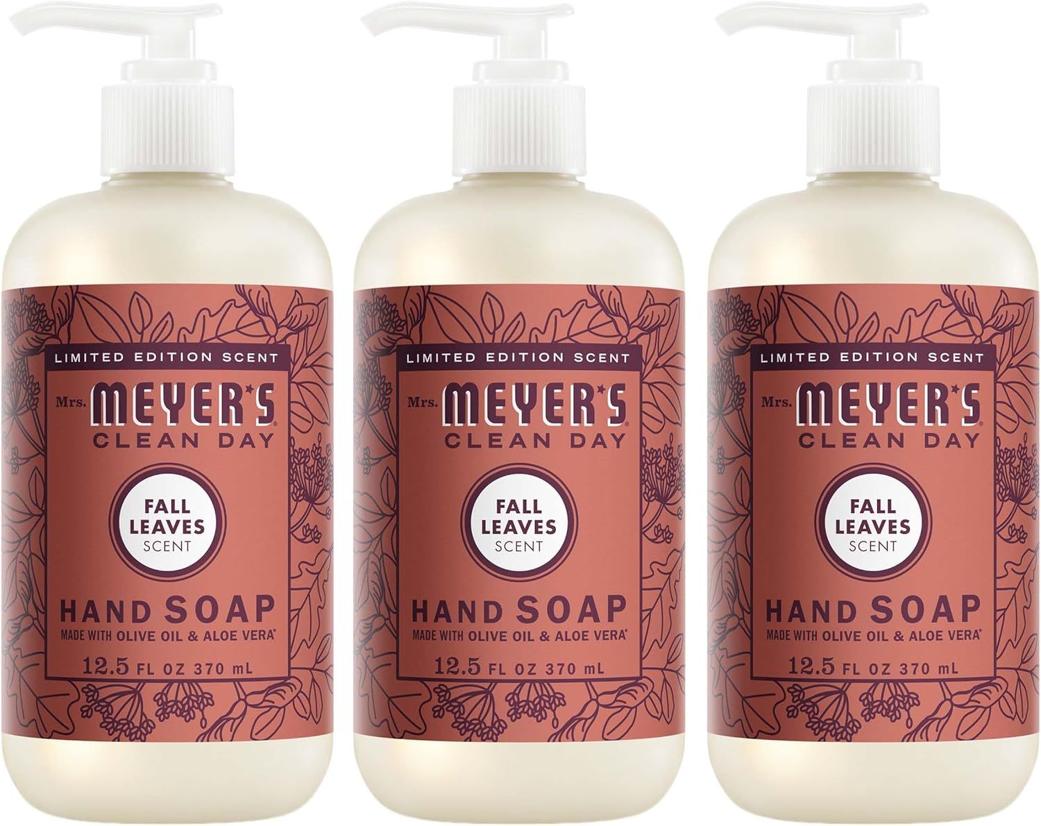 Shows three bottles of the hand soap product to communicate that this is a multi-pack purchase, clearly displaying the Fall Leaves scent variant and Mrs.…