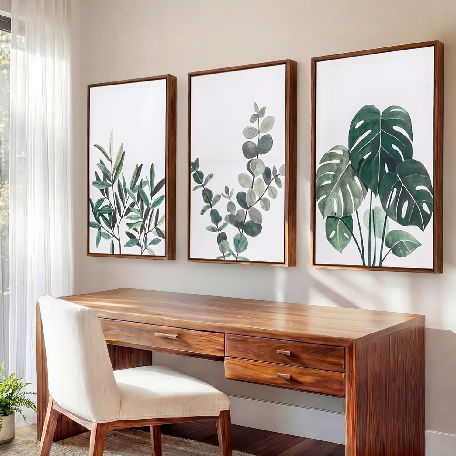 Shows the framed botanical prints displayed in a real home setting to help shoppers visualize how the product will look in their own space and inspire decorating ideas.