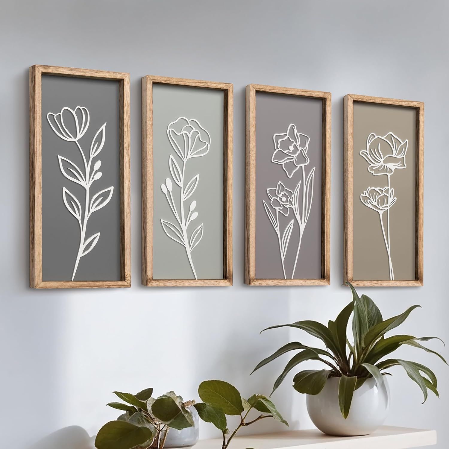 Shows the core product—a set of four framed floral wall art pieces—displayed in a lifestyle setting to help shoppers visualize the complete set and its aesthetic appeal. Demonstrates how the wall…