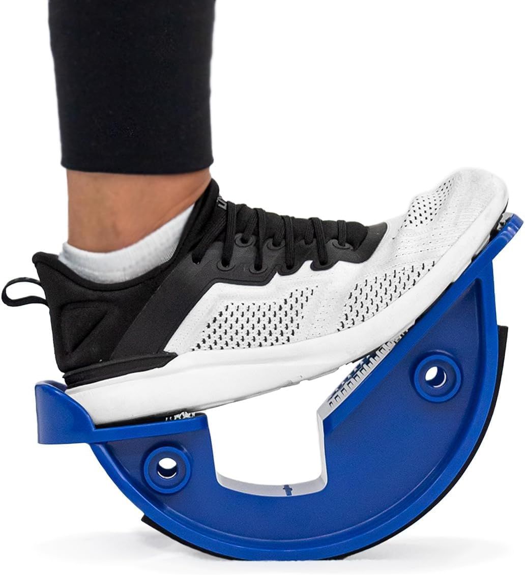 Shows a person using the product to demonstrate its size, how it fits under the foot, and how it is used for stretching or balance exercises. Demonstrates the product actively in use as a foot…