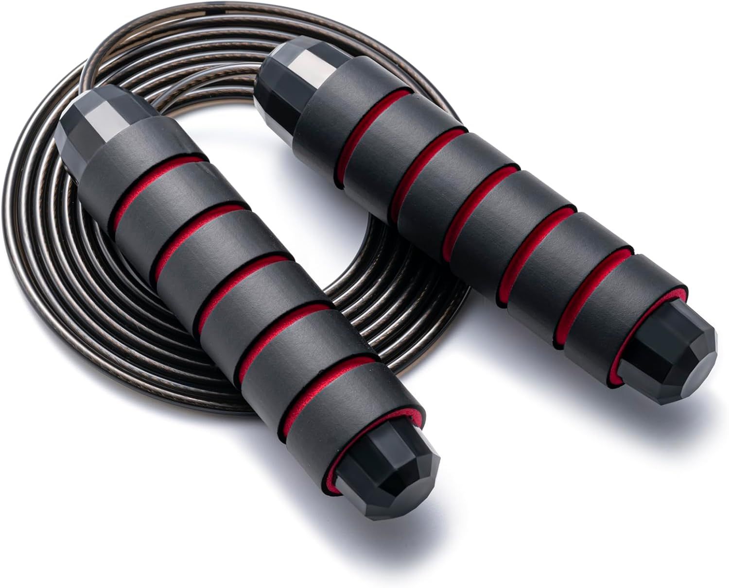 Displays the jump rope product clearly on a white background to show the ergonomic foam grip handles with red accent rings and the coiled cable design, helping shoppers understand the product's…