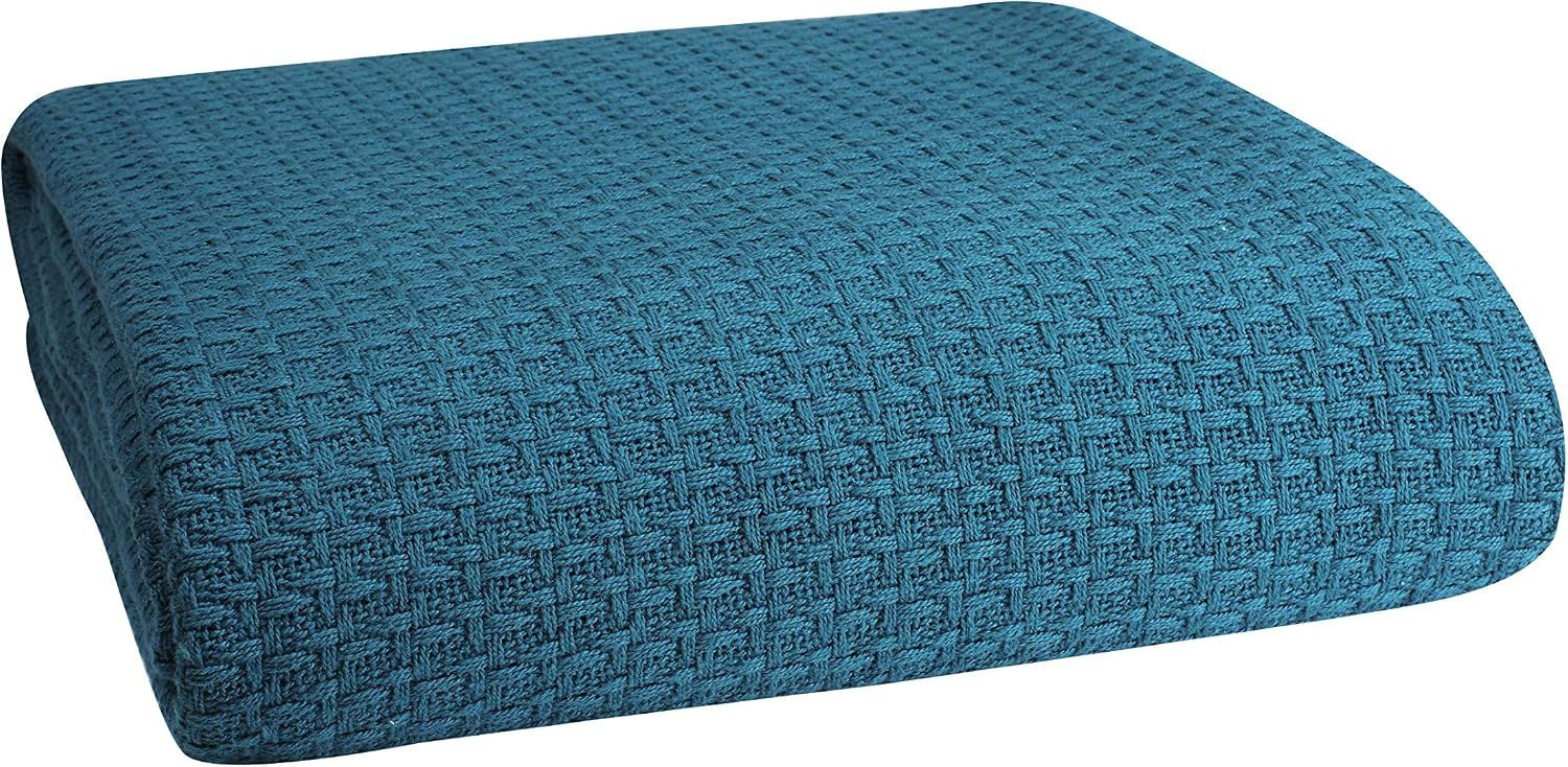 Displays the core product, a textured woven blanket or throw, in a clean catalog-style presentation to show its color, texture, and overall appearance. Uses a subtle drop shadow beneath the product…
