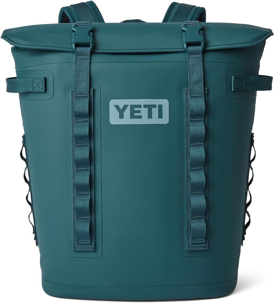 Displays the core YETI backpack cooler product in a clean catalog style, allowing shoppers to clearly see the design, roll-top closure, straps, and branding.