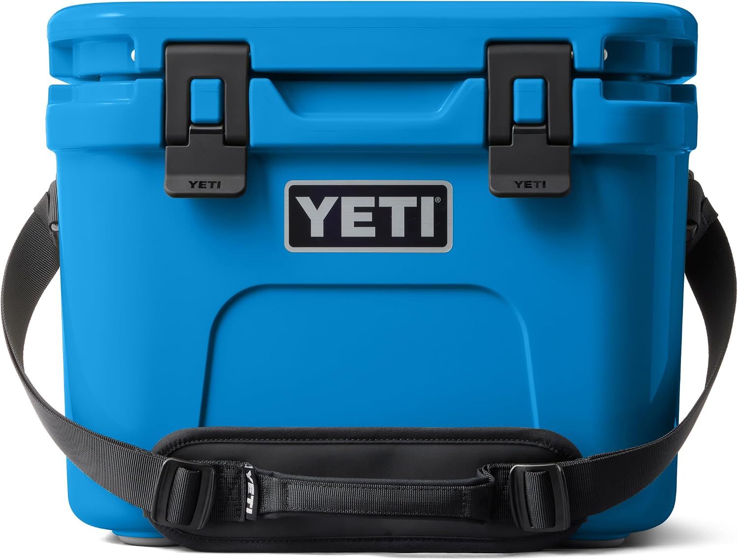 Displays the YETI cooler as the core product with its distinctive blue color, robust construction, secure latches, and carrying strap to communicate durability and portability for outdoor adventures.