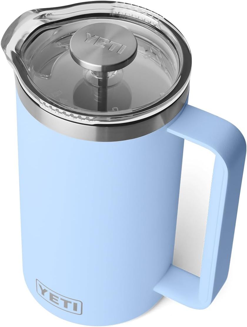 Displays the core product clearly to show shoppers the YETI insulated mug's design, including its handle, clear lid, and powder-coated finish in a clean catalog presentation. Uses a subtle drop…