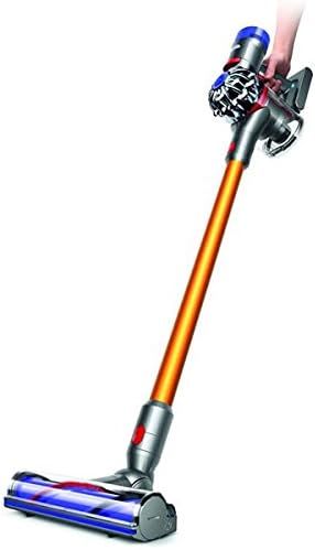 Displays the complete cordless vacuum cleaner in a clean catalog style to show shoppers the full product design, distinctive orange wand, and motorized floor head. Shows a hand holding the vacuum to…