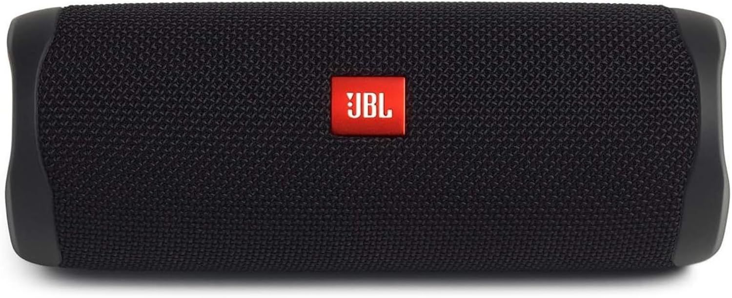 Shows the core speaker clearly so shoppers can see its design, color, and build quality on a clean catalog view. Uses a dark backdrop to make the speaker's black fabric texture and red JBL badge…