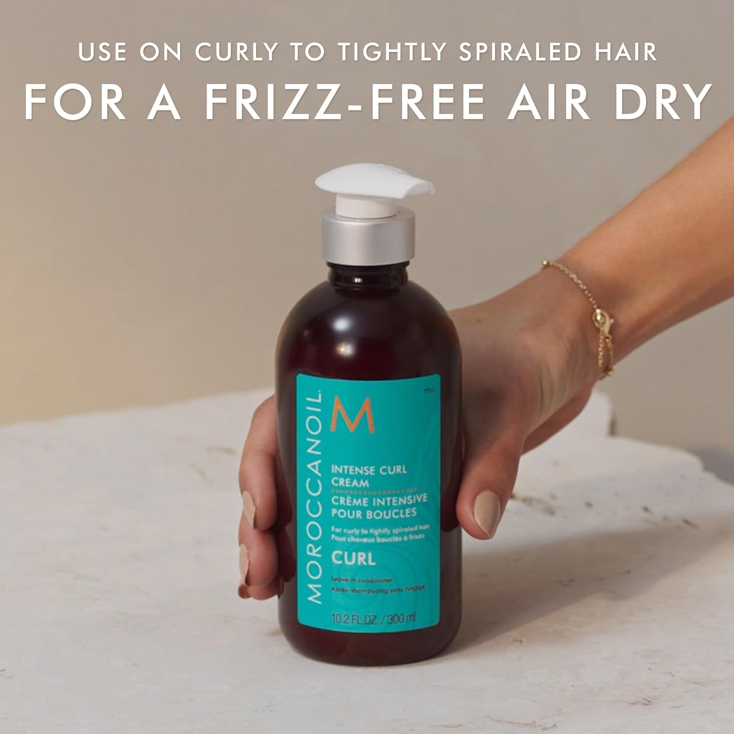 Highlights the product's ability to provide a frizz-free air dry for curly, tightly spiraled hair.