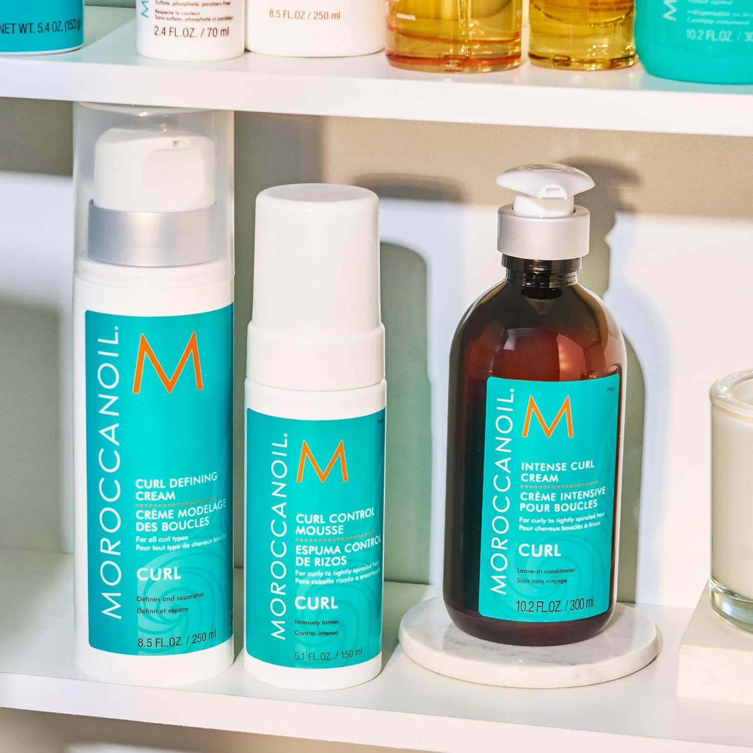 Shows the different hair care products included in the curl-enhancing line, allowing customers to see the full range of options available.