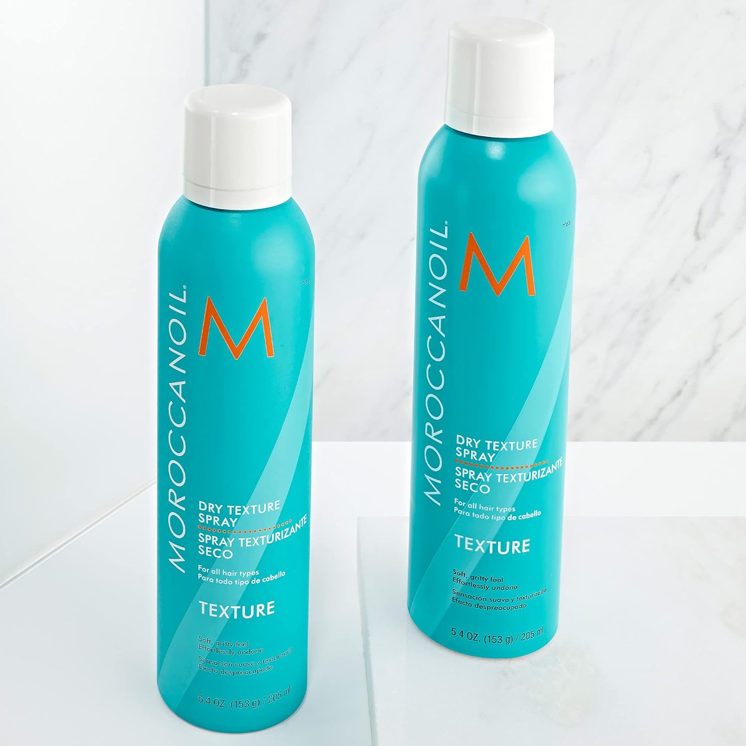 Highlights the product's ability to provide a dry, textured finish for hairstyling.