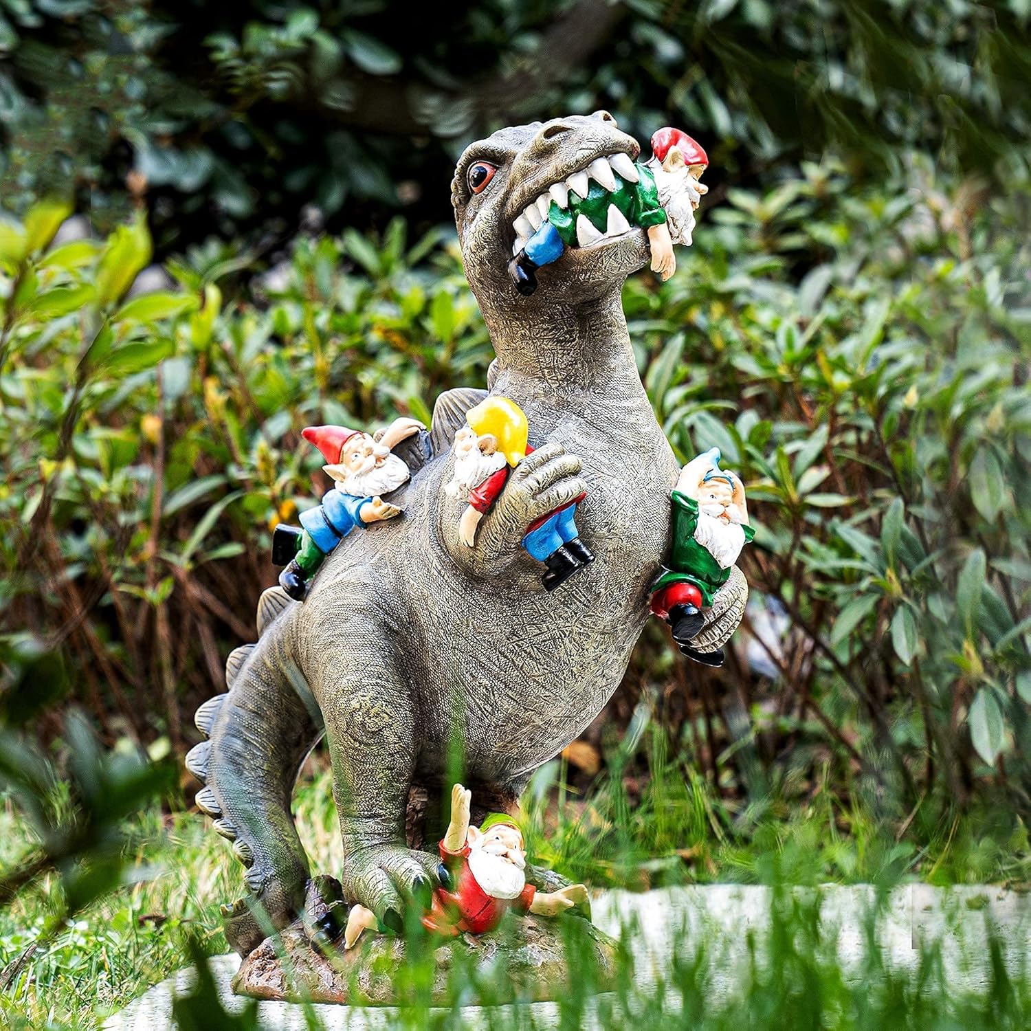 Showcases the product in a realistic outdoor garden setting to demonstrate its use as a whimsical lawn ornament.