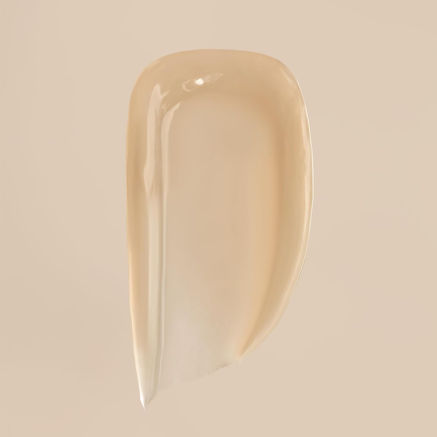 Demonstrates the creamy, smooth texture of the product to highlight its quality and ease of application.