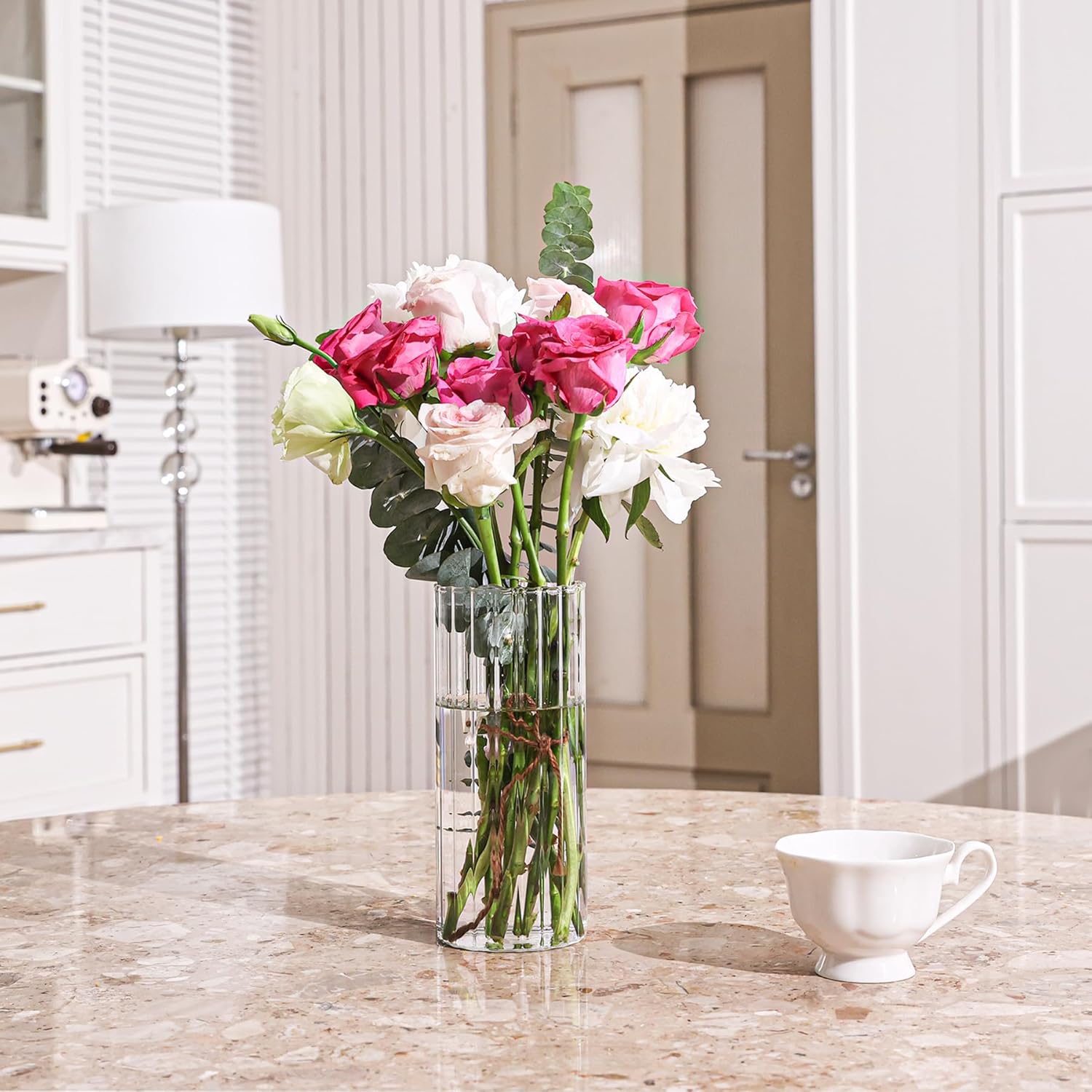 Shows how the product (likely a vase) enhances home decor with fresh flowers, creating an inviting and elegant atmosphere.