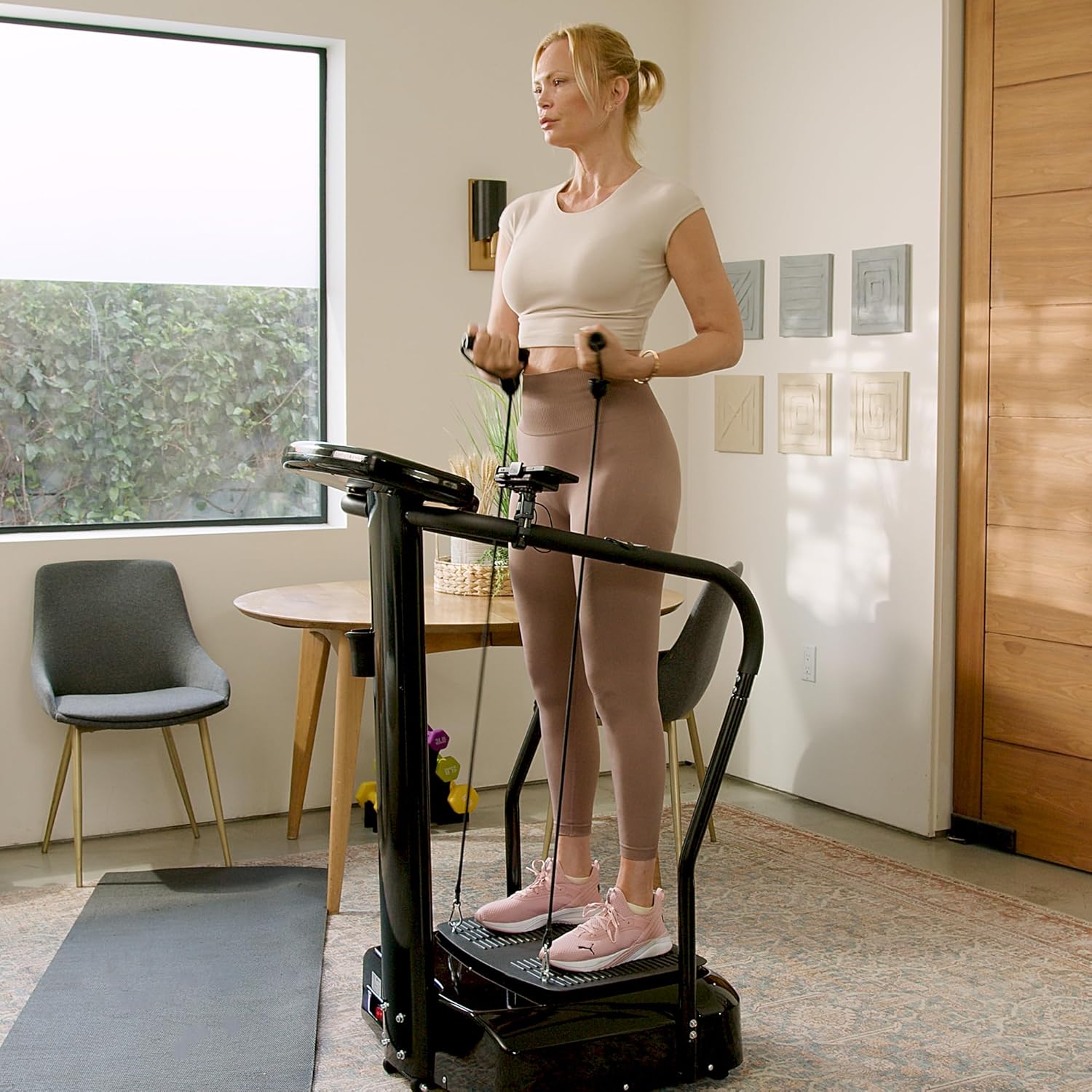 Shows the product being used in a home setting, demonstrating how it fits into everyday life and can be used in small spaces. Illustrates how the product can be used for fitness at home, even in a…