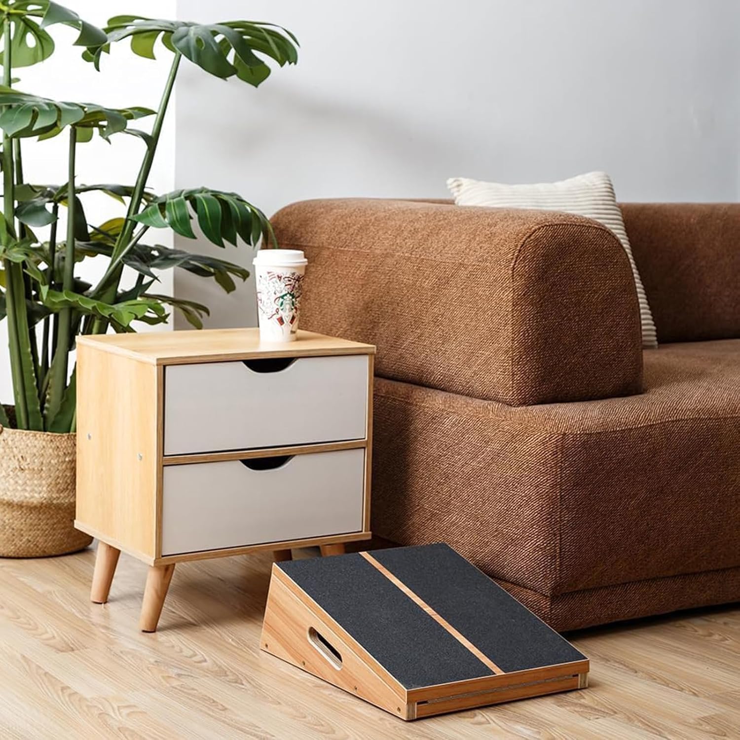 Shows the product in a real-world living room context to help shoppers visualize how it fits into a home setting.