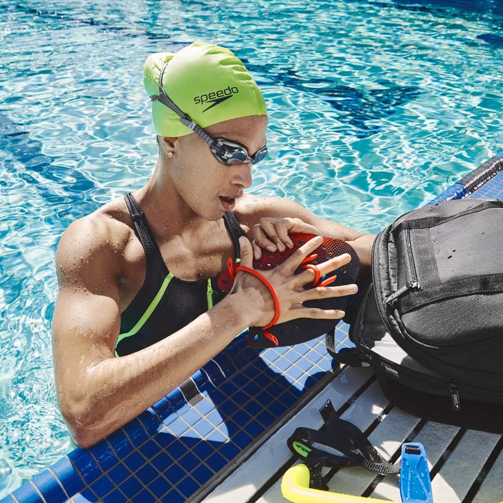 Shows the product being used in a real swimming context, demonstrating its relevance for serious swimmers and training scenarios.