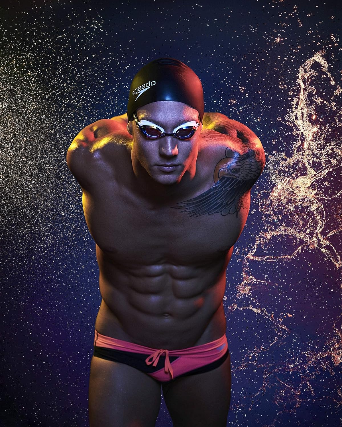 Showcases the product in a dynamic, high-performance context to appeal to serious swimmers and athletes. Emphasizes the streamlined, water-cutting properties of the swimwear through dramatic water…