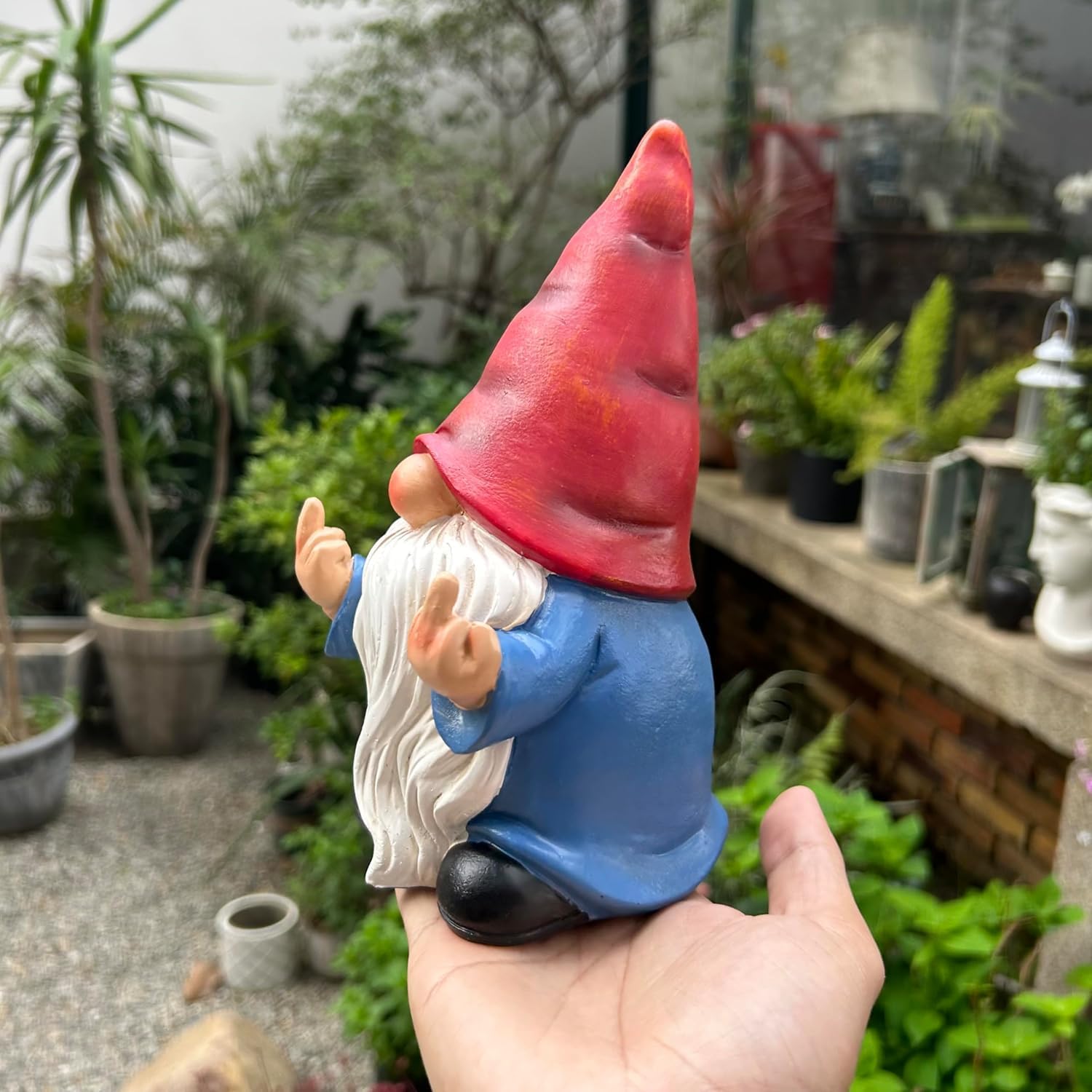 Shows the product in a real-world garden setting to demonstrate how it can be used as outdoor decoration.