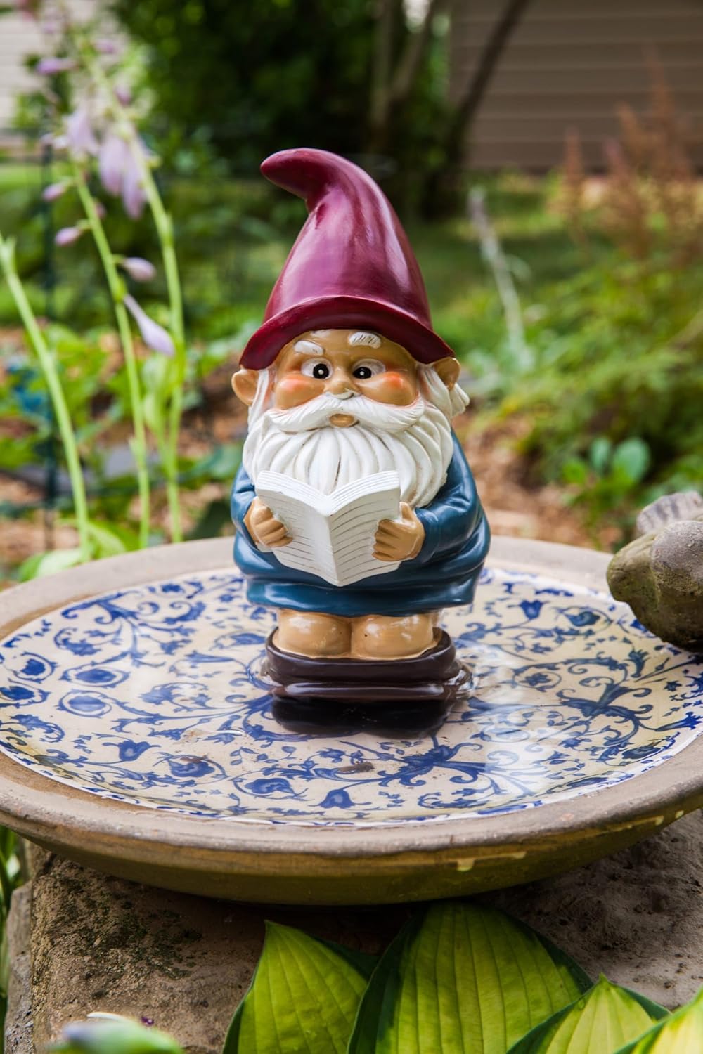 Shows the product in a realistic garden setting to demonstrate how it can be used as decorative outdoor decor.