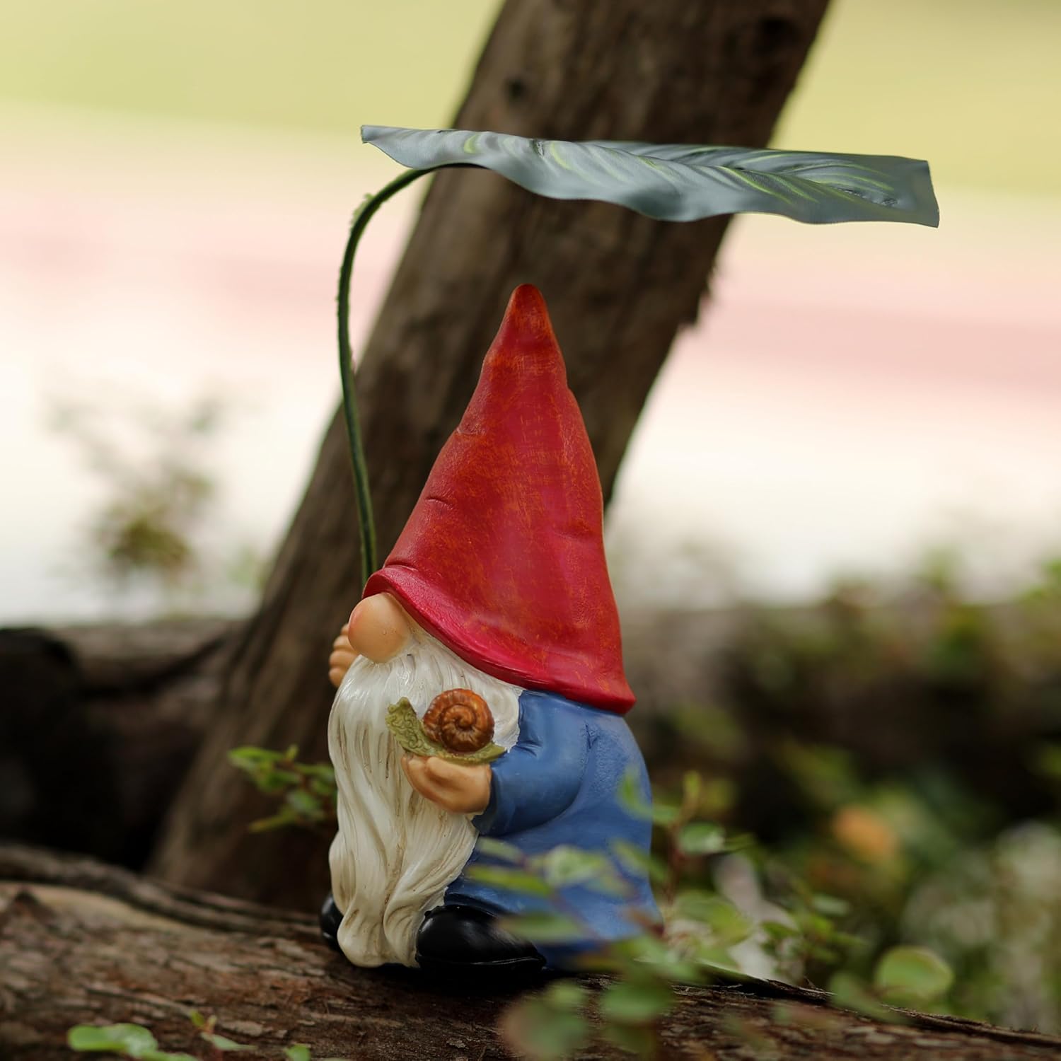 Shows the product in a natural outdoor setting to demonstrate its use as a decorative garden ornament.