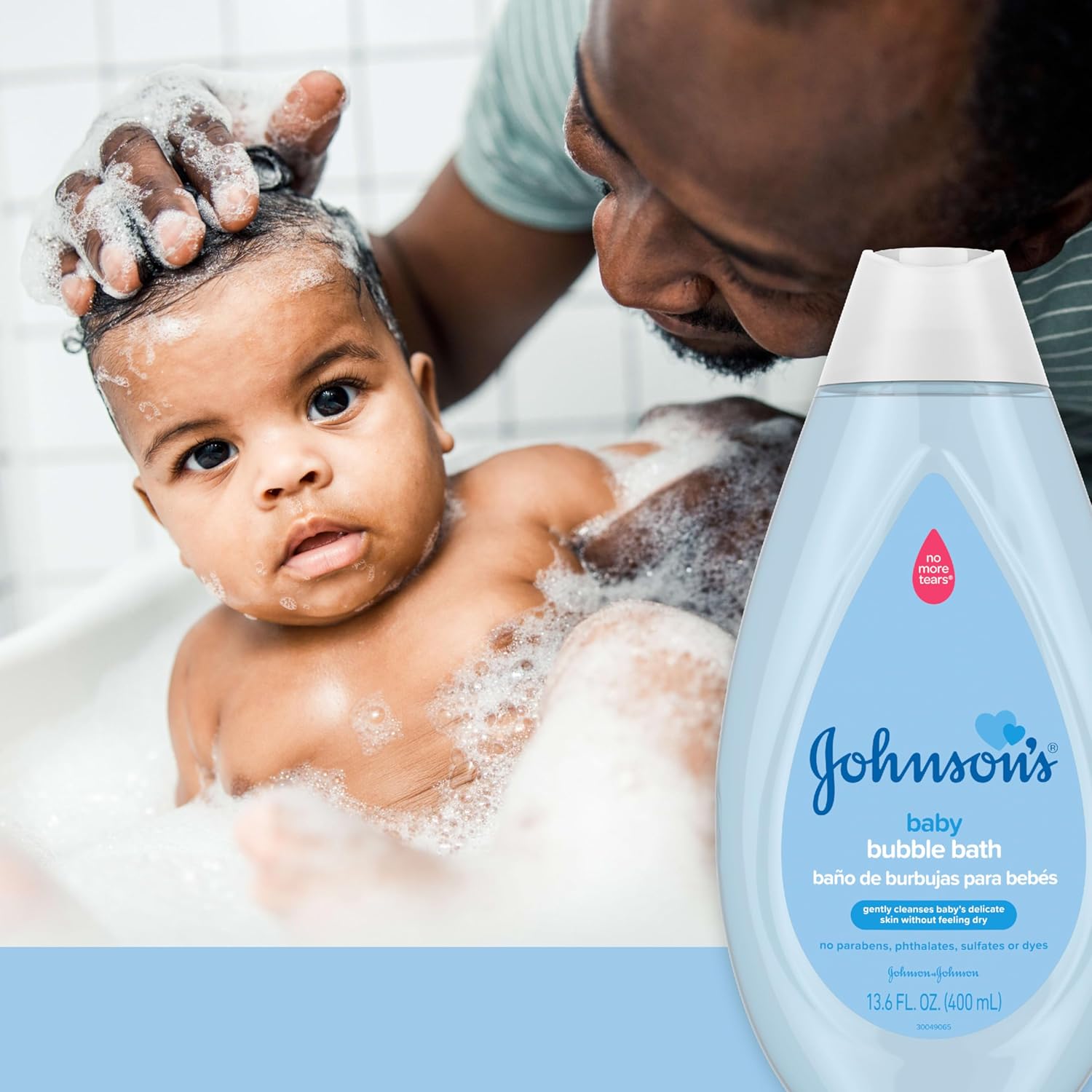 Demonstrates the product's gentle cleansing ability for baby's delicate skin, showing a father bathing a baby with the bubble bath.