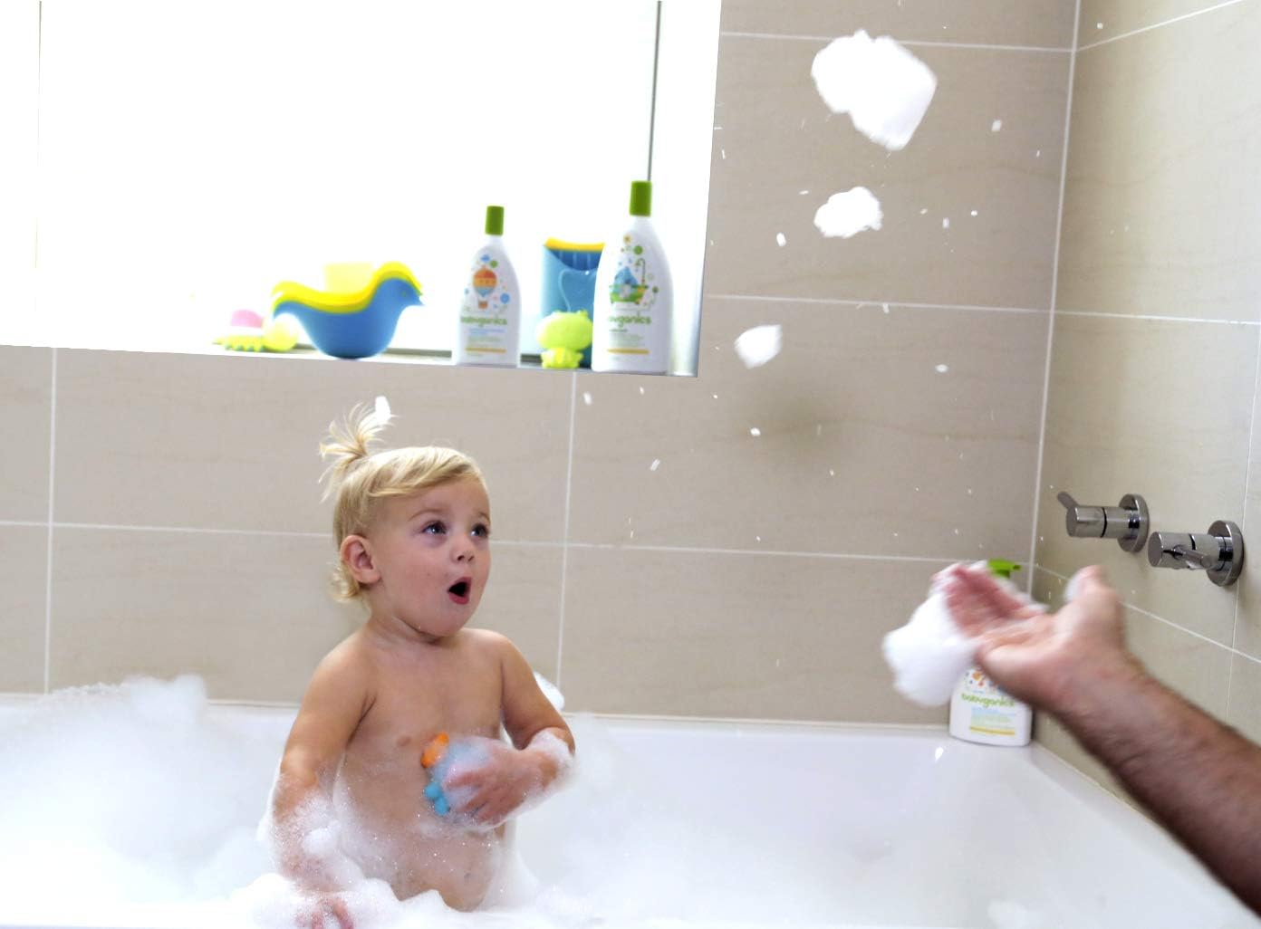 Shows the product being used in a real-life bath time scenario, demonstrating its suitability for children and fun factor.