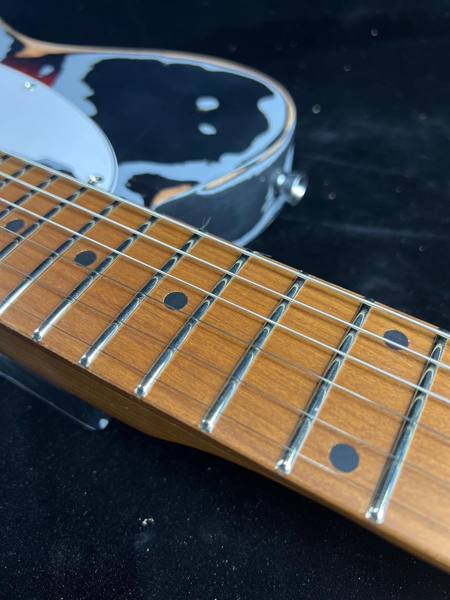 Showcases the quality and craftsmanship of the guitar, focusing on the fretboard and body details to appeal to musicians and instrument enthusiasts.