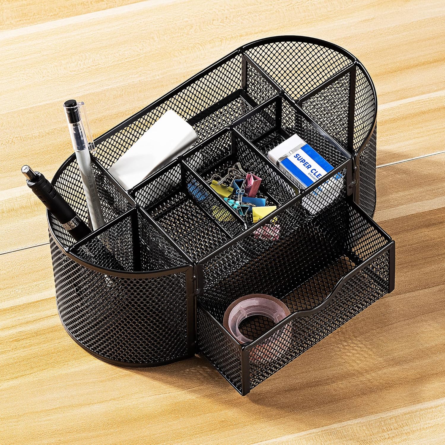 Shows the various compartments and storage options of the desk organizer, demonstrating its capacity to hold different office supplies.